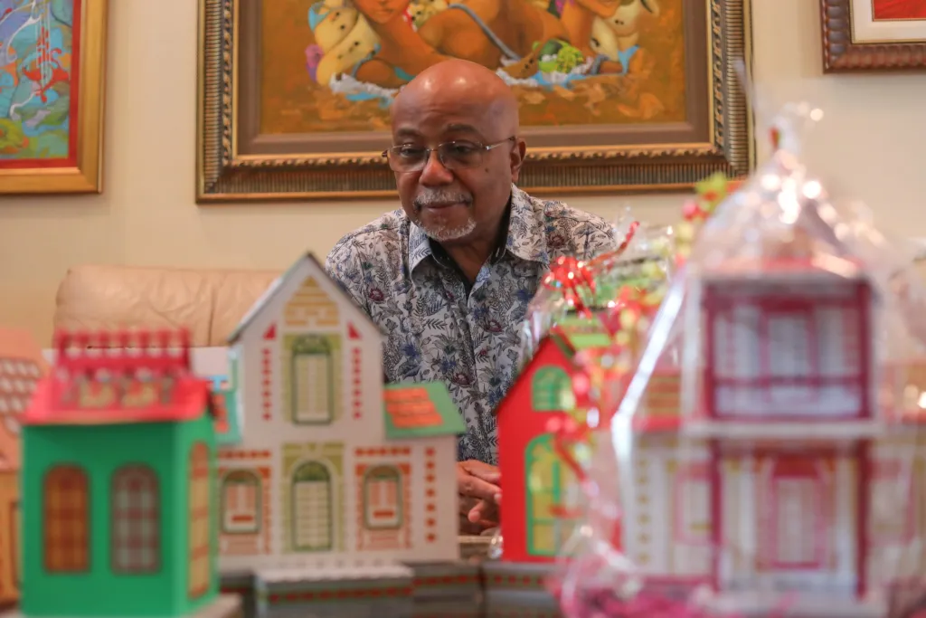 Alphonse Piard / On December 14, 2022, Alphonse Piard poses with fanals he made. Photo by (Ashley Miznazi/ The Haitian Times)