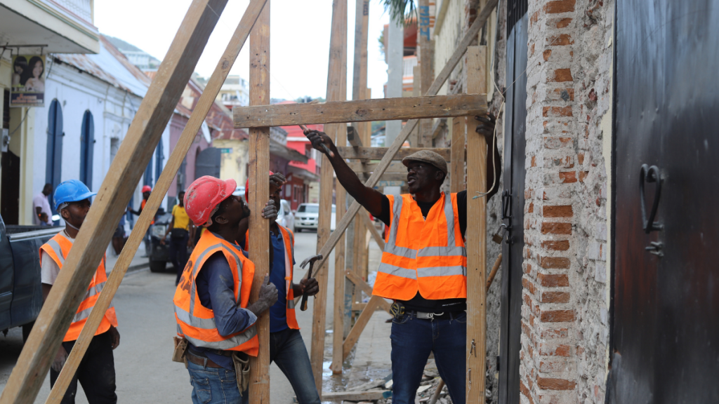 Construction workers / On March 30, 2022, construction employees in Cap Haitian used nails to join boards. Photo by Onz Chery for The Haitian Times