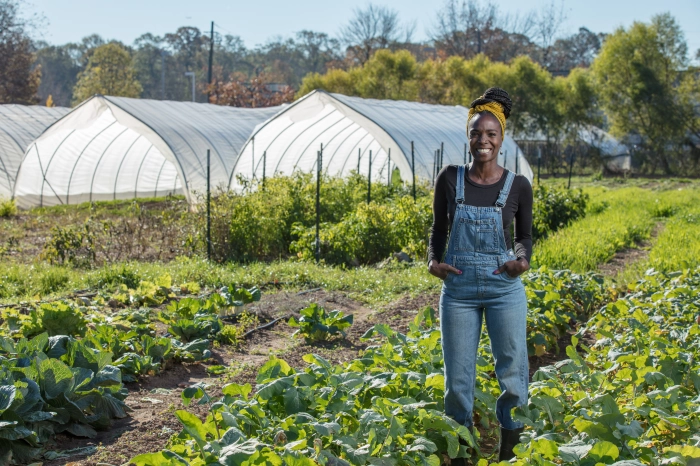 Homegrown Photoshoot / Jamila Norman, the host of Homegrown, stands among crops at an Atlanta farm. Photo by MAGNOLIA NETWORK