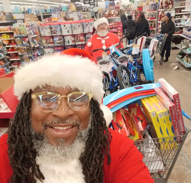 Northside Santa 2 / The Santas Charles Caldwell (front) and Mike Oker shopping for toys. / Submitted photo