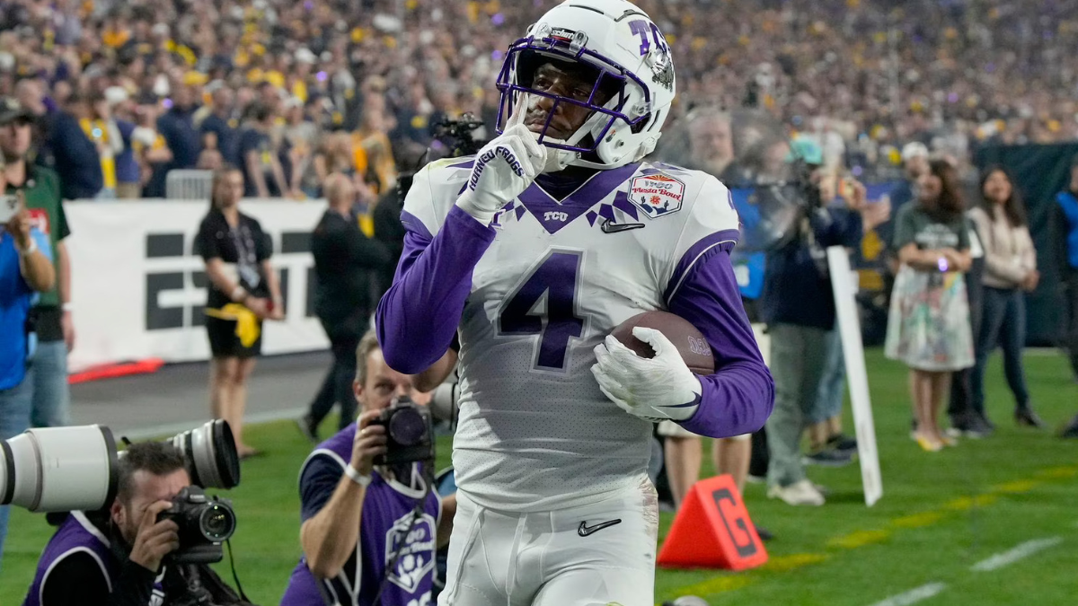 Taye Barber / TCU wide receiver Taye Barber (4) celebrates his score against Michigan during the first half of Saturday, December 31, 2022's Fiesta Bowl NCAA college football quarterfinal playoff game in Glendale, Ariz. Photo by (Rick Scuteri / ASSOCIATED PRESS)